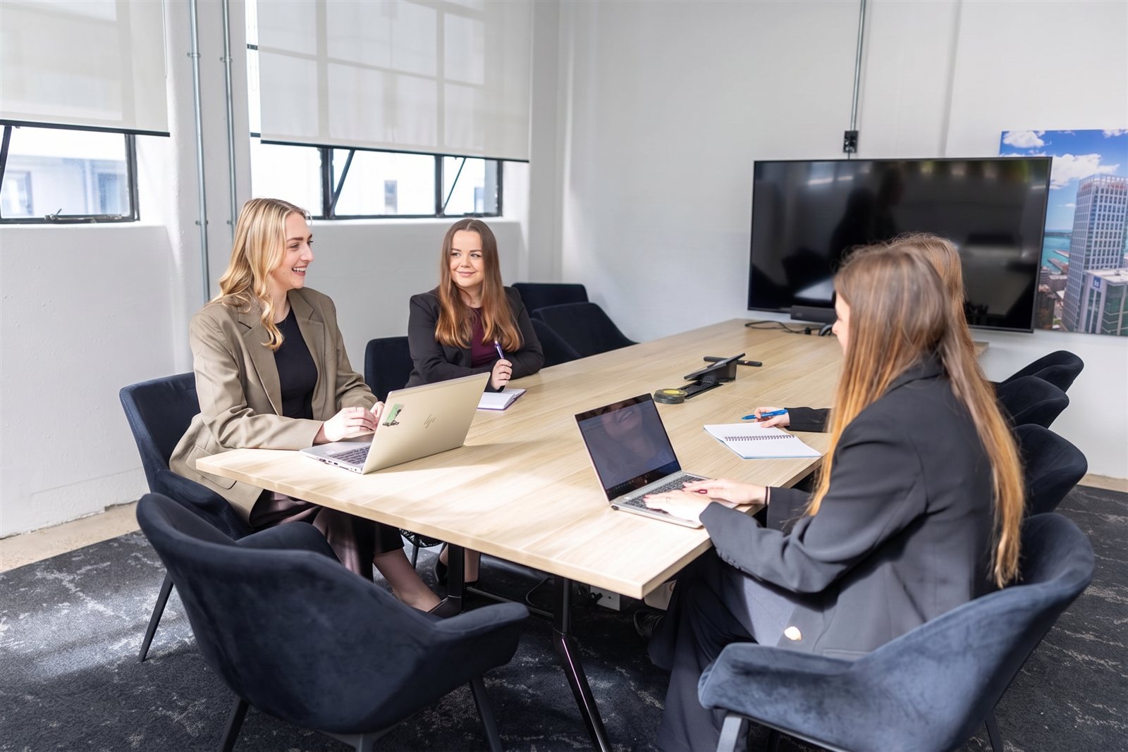 Hello Monday consultants working together in the boardroom