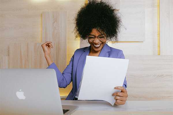 Women being excited while reading letter