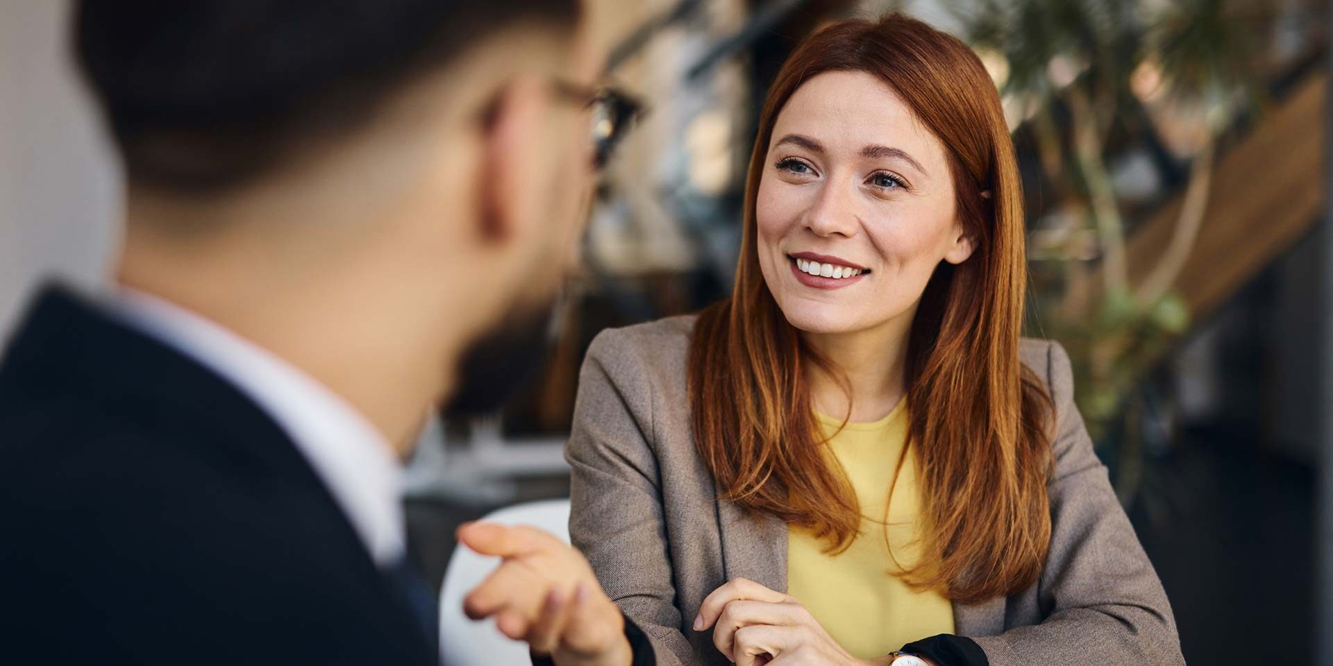 Office woman having meeting with male colleague